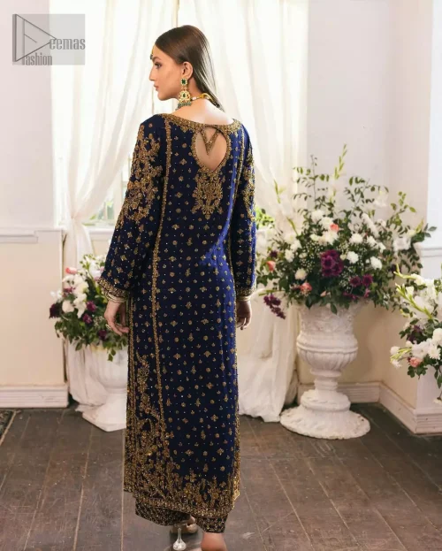 Soft fawn dupatta gently ties together the navy and gold ensemble, offering a composed and balanced party look.