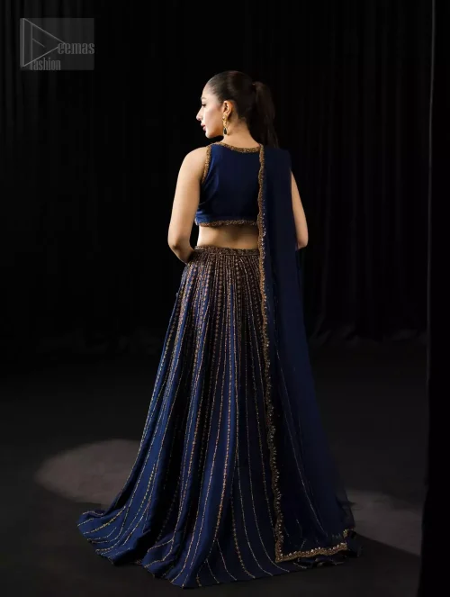 The fit and flare lehenga swirls in royal rhythm to create a symphony of confidence and beauty.