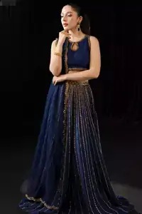 Pure silk and chiffon shimmer like midnight waves when the Navy Blue Lehenga Blouse carries its mesmerising depth and grandeur.