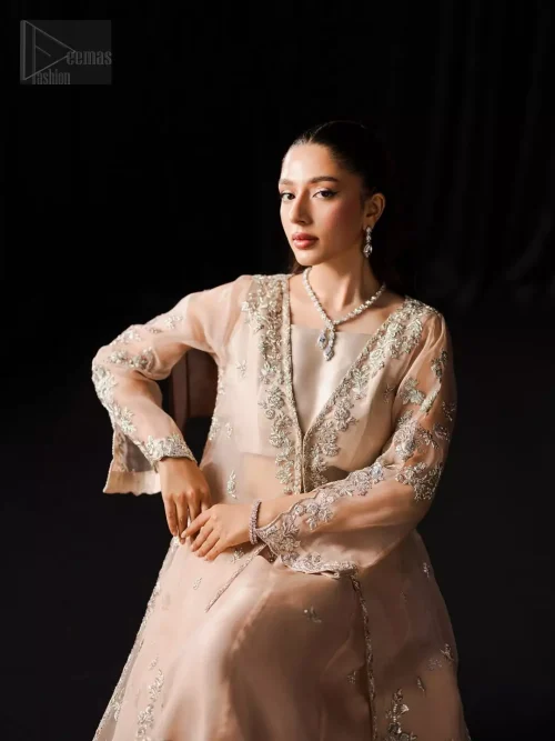 The front open jacket blooms in thread and silver embroidery, as every minute detail is crafted with devotion and delicacy.