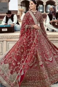 Make your day bright and bold! Deemas Fashion presents a beautiful red outfit which involves silver embroidery and is covered with tilla, dabka, kora, Kundan and the beautiful details of Zardozi. The full sleeves are covered with attractive floral patterns. Further, the jewel neckline gives a romantic touch to this beautiful outfit. The?Bridal Lehenga?has a massive flare and it gives the gorgeous bride a breathtaking look on the big day.?The Lehenga is gracefully emblazoned with?sequins, crystals, and Resham. Intricate details of zardozi and gota make this Lehenga Dress an epitome of grace. A beautiful dupatta with floral patterns & beautiful embellished border completes the look. Top: Blouse Colour: Red Fabric: Organza Fully Embellished Jewel Neckline Silver Embroidery Full-Length Sleeves Floral Patterns Concealed With Side Zip Finished Edges Bottom: Lehenga Colour: Red Fabric: Organza Fully Embellished Flared Finished Edges Fixed Waist Belt With Side Zip Closure Dupatta: Colour: Red Fabric: Net Floral Patterns Dupatta Having Four Sides Embellished Border Finished Edges Embellishment : Work includes kora, dabka, stones, sequins, beads, silk threads and Swarovski crystals. 100% pure highest quality imported fabric.
