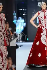 Deep red pure velvet front open embellished gown and red pure chiffon inner gown. Upper gown is adorned with embellished long neckline.