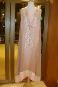 This shirt is perfect for a day to evening wear. Gussy up in this luxuriously designed shirt emboldened with thread embroidery along with beautiful rich patterns and delicate details on neckline. Embroidery is in two colors. It is coordinated with churidar pajama. This outfit is paired up with matching chiffon dupatta.